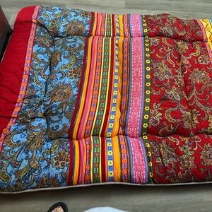 Vibrant Paisley and Stripe Quilt, there are (3) pallets for sleeping